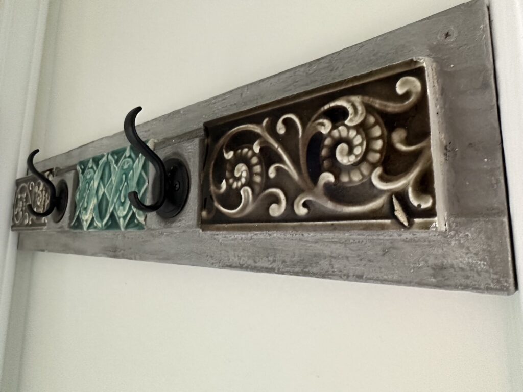 Antique 1940's wall tiles adorn this repurposed into wall rack