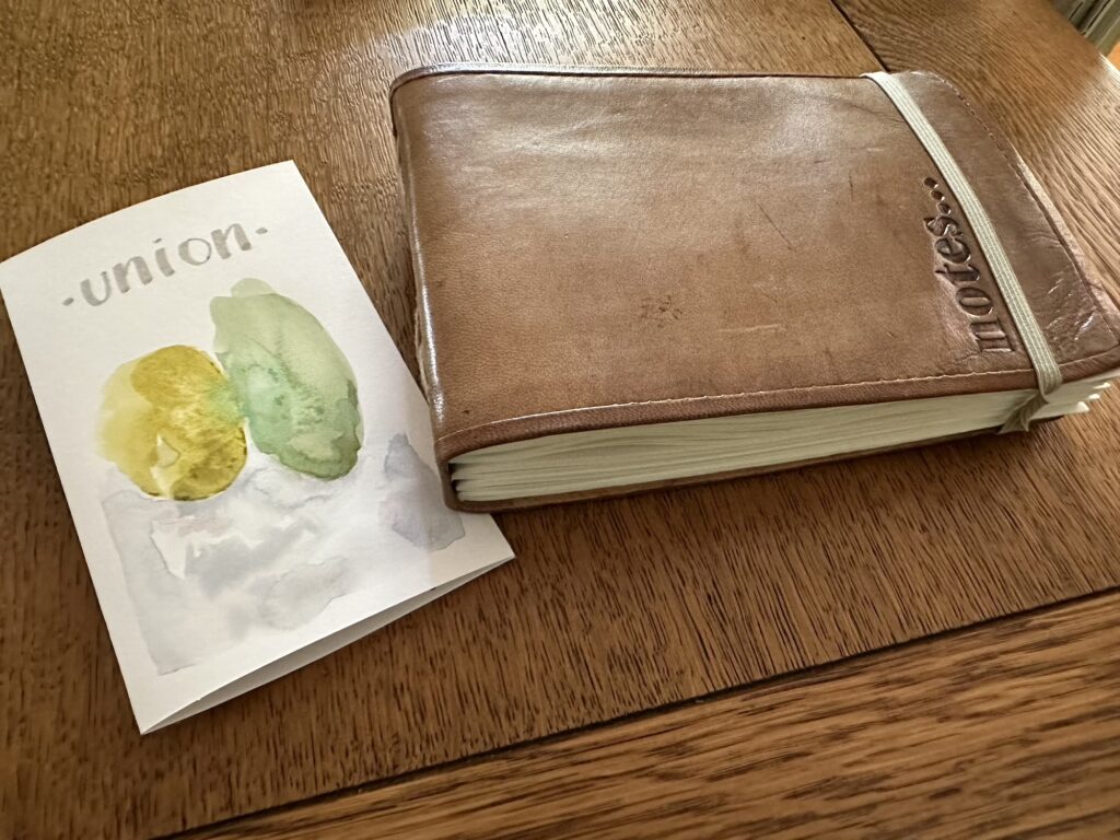 Old leather bound journal is repurposed into wedding gift filled with watercolor studies and sketches